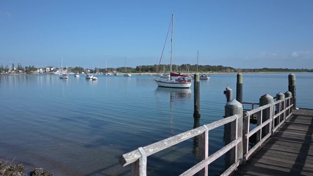 Sail boatS mooring on the Hastings River in New South Wales, Australia. The Hastings River is a 180 km long river in NSW that flows into the sea at Port Macquarie. 