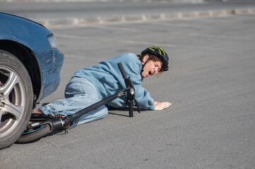 Obraz premium A Caucasian woman on a scooter after being hit by a car.