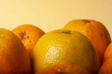 oranges on a yellow background
