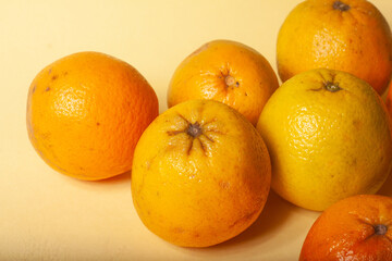 oranges on a yellow background