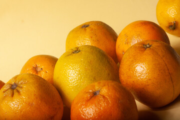 oranges on a yellow background