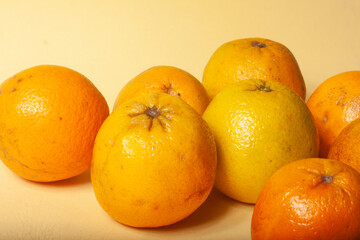 oranges on a yellow background