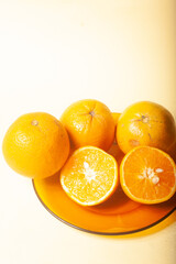 oranges on a yellow background