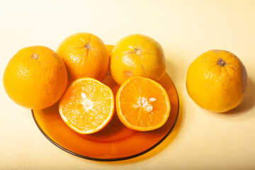 oranges on a yellow background