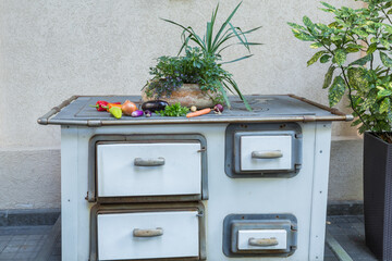 Vintage wood-burning stove used as decoration in a restaurant