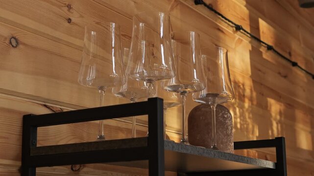Aesthetic view inside wooden house where sunlight creates warm reflections natural texture highlights harmony glass detail shines glass surface mirrors beams glass adds depth to rustic serene mood