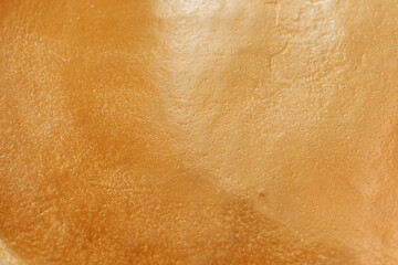 Fototapeta premium Shimmering gold texture.Festive New Year and Christmas Wallpaper.Matte gold wallpaper