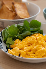 Breakfast Plate with Scrambled Eggs, Toast, and Green Vegetables