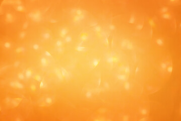 Glitter background with defocused lights. Abstract photo of dark yellow sparkles. Golden blurred