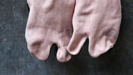 Socks are hung on the wall to dry quickly, with cream color for women.