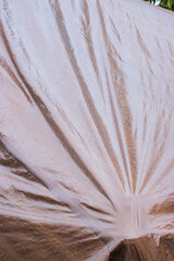 Rain on a brown tarp