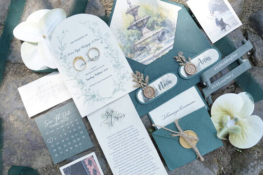Elegant Wedding Invitation Suite with Rings and Botanical Details