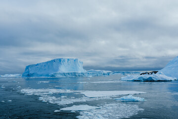 Beautiful iceberg with a hidden mountain in the sea with a view underwater. Hidden danger, concept. Tip of the iceberg. Creative idea. Blue color.