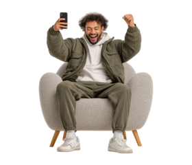 Excited Man Wins Online, Celebrating Success with Smartphone in Armchair isolated on a transparent background