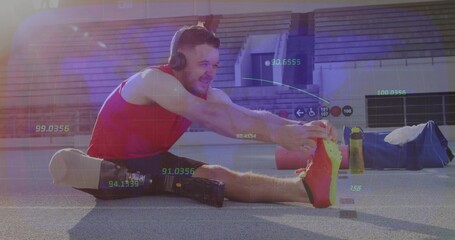 Mid-adult athlete stretching on stadium track, wearing red top with prosthetic leg and headphones