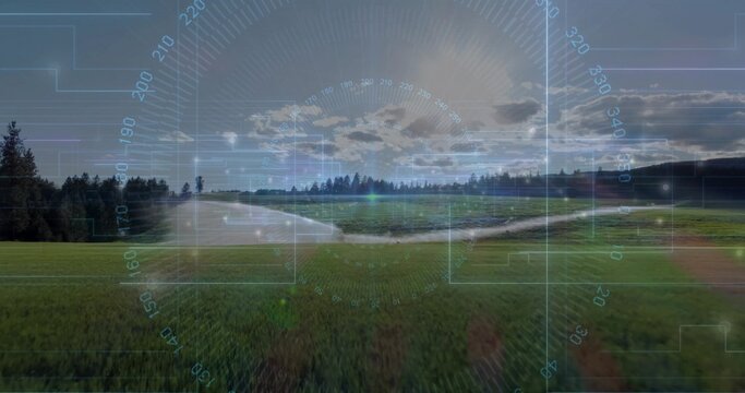 Fototapeta Overlaying meadow with stream under translucent HUD in rural field, compass ring and grid overlays