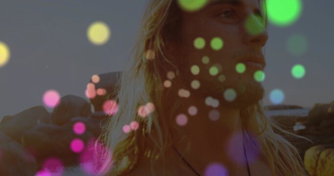 Shirtless necklace-wearing man gazing at sunset overlook, with convertible and bokeh, copy space