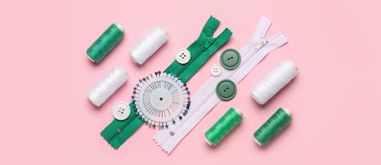 Many threads and sewing supplies on pink background, top view