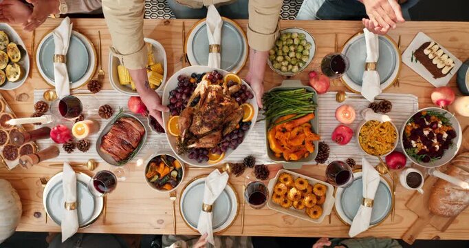 Family, meal and applause for chicken, hands and celebration of Christmas dinner, reunion and feast. Festive season, above and people with food for thanksgiving, December holiday and together in home