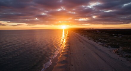 Sunset over beach shoreline