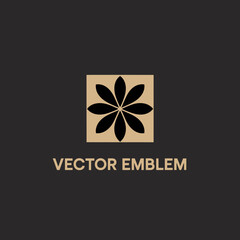 This sophisticated black and gold emblem features a stylized floral design, perfect for branding or decorative purposes, adding a touch of luxury and elegance.