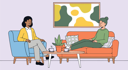 Two women having a conversation on a couch and chair