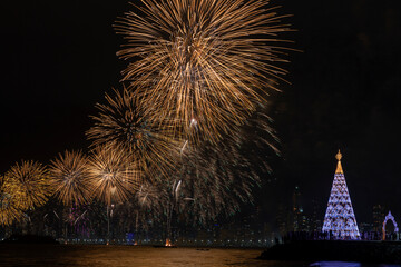 Christmas tree and fireworks on New Year's Evein Balneario Camboriu Santa Catarina Brazil.