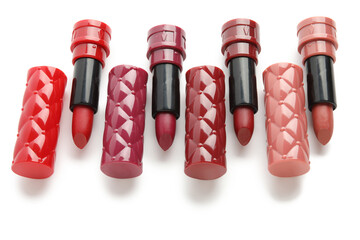 Different stylish lipsticks on white background