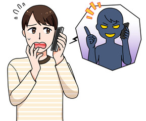 詐欺電話の対応をする男性