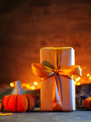 Autumn gift box, mini pumpkins on colorful background