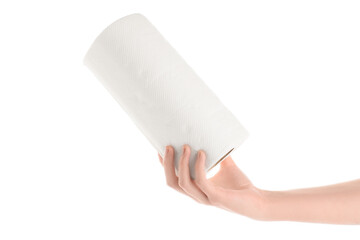 Female hand with roll of paper towels on white background