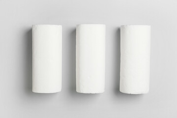 Rolls of paper towels on grey background