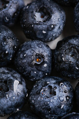 Blueberries soaked in water, detail close-up with water droplets