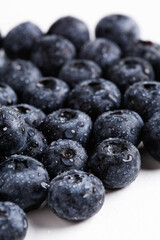 Blueberries soaked in water, detail close-up with water droplets