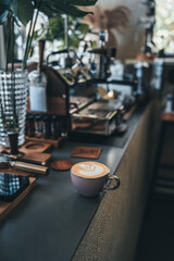 Coffee latte in a cafe, low-saturation colors and quiet atmosphere