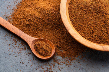 Dry instant ground coffee in a bowl and scoop - Coffea