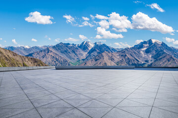Empty square floor and majestic mountain range natural landscape on a sunny day