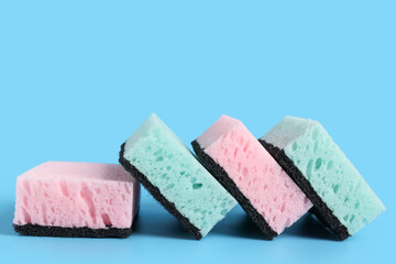 Sponges for cleaning on blue background