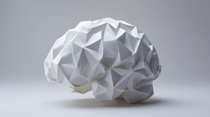 White origami brain model on a plain background.