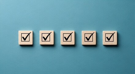 Obraz premium Five wooden blocks in a row with a checkmark in each, signifying completion or a todo list on a blue background