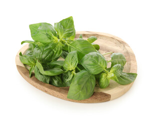 Wooden board with basil leaves on white background