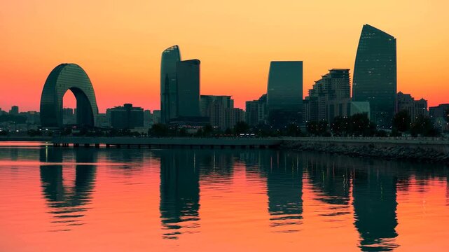Baku skyline at sunset reflecting on the Caspian Sea