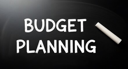 Budget planning written in chalk on a blackboard with a piece of chalk on the side