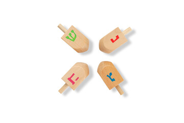 Four colorful dreidels with Hebrew letters, isolated, PNG