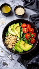 Healthy bowl of quinoa, avocado, and cherry tomatoes