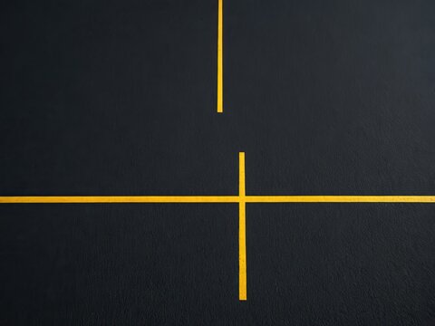 Yellow lines cross on black background. Abstract geometric design