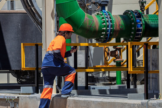inspection young mining engineer worker inspecting pipes and valves in a diamond mine in Botswana