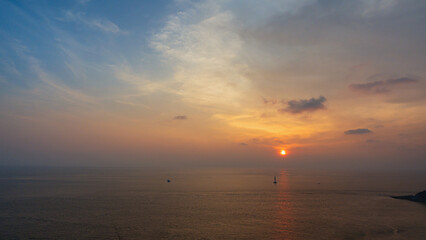 Beautiful sunset on the coast with colorful sky background.