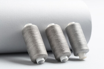 Spools of thread on grey background