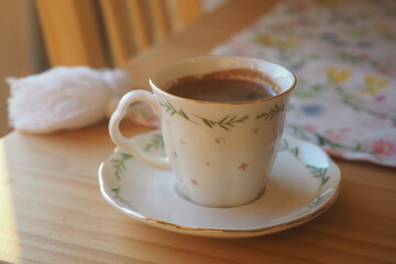 turkish Coffee cup on a wooden table in morning light